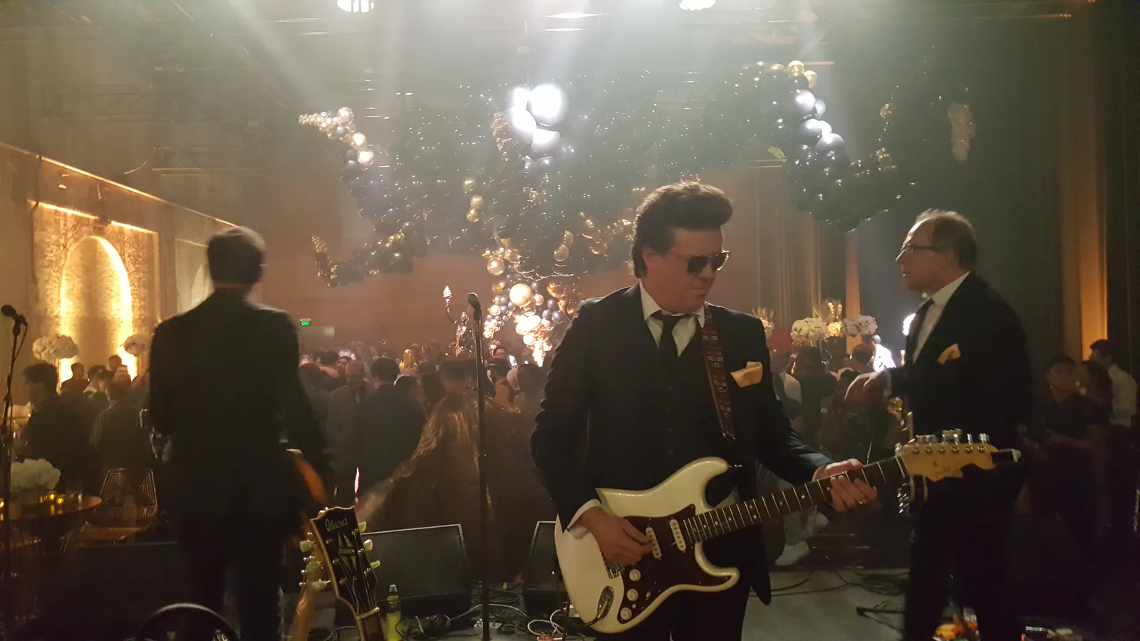 The Pragmatics with horn players performing at a corporate Christmas celebration