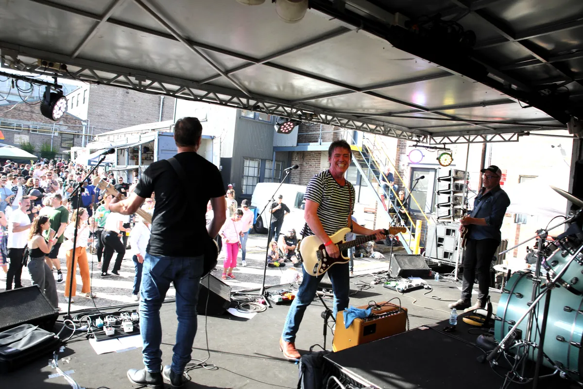 The band playing to an outdoor audience at Willie the Boatman, seen from the stage